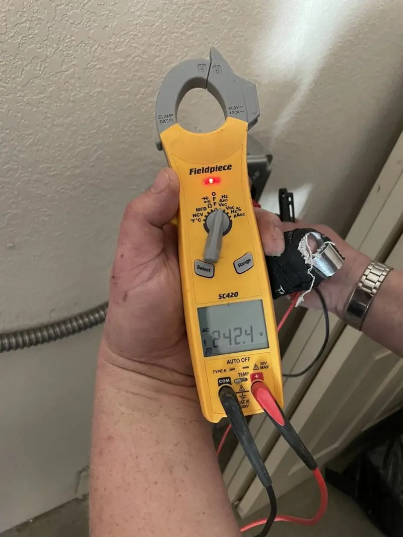 Voltage testing with clamp meter during Aluminum Wiring Replacement in Wiggins